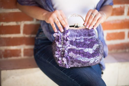 purple Elegant Felting wool fashion handmade handbag in hand. street fashion look