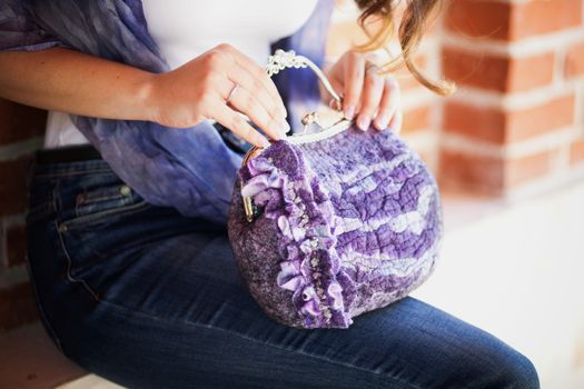 purple Elegant Felting wool fashion handmade handbag in hand. street fashion look