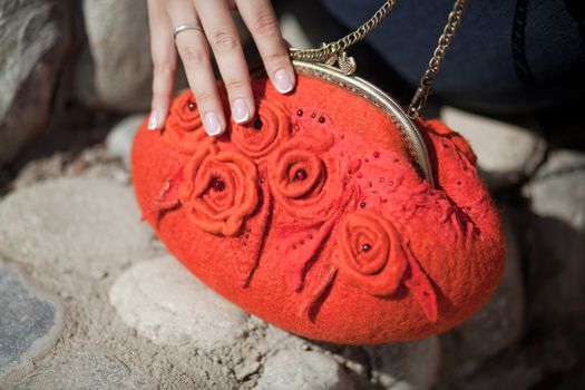 red Elegant Felting wool fashion handmade handbag in hand. street fashion look