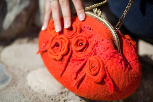 red Elegant Felting wool fashion handmade handbag in hand. street fashion look