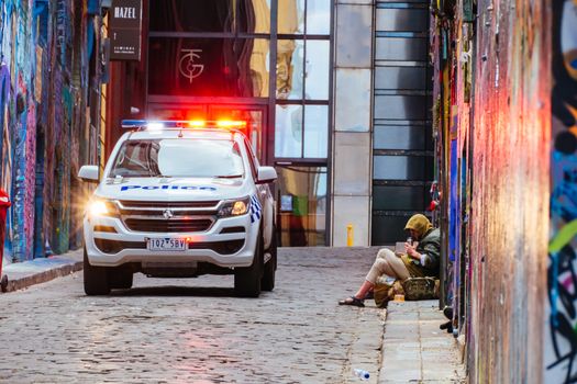Melbourne, Australia - October 10th 2020: Police do routine checks against pandemic rules in Hosier Lane during the Coronavirus pandemic and associated lockdown.