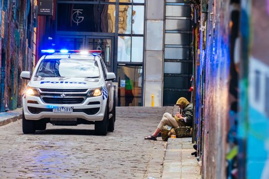 Melbourne, Australia - October 10th 2020: Police do routine checks against pandemic rules in Hosier Lane during the Coronavirus pandemic and associated lockdown.