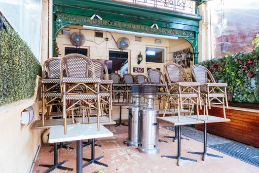 Melbourne, Australia - October 10th 2020: Lygon St restaurants are closed and packed up empty during the Coronavirus pandemic and associated lockdown.