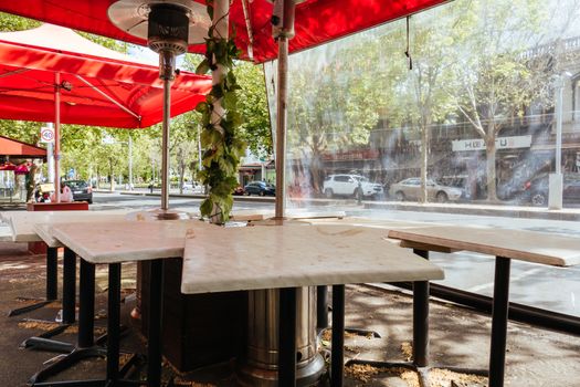 Melbourne, Australia - October 10th 2020: Lygon St restaurants are closed and packed up empty during the Coronavirus pandemic and associated lockdown.