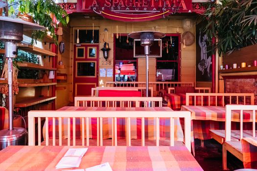 Melbourne, Australia - October 10th 2020: Lygon St restaurants are closed and packed up empty during the Coronavirus pandemic and associated lockdown.