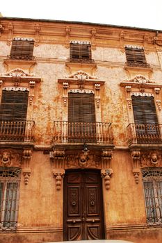 Colorful and majestic old house facade in Caravaca de La Cruz, Murcia, Spain in a sunny day of Spring