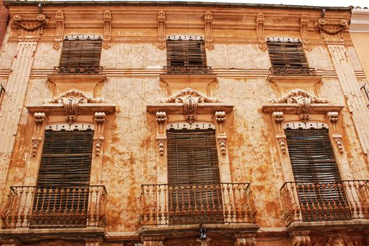 Colorful and majestic old house facade in Caravaca de La Cruz, Murcia, Spain in a sunny day of Spring