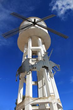 Water tank shaped like a windmill and Quixote picture in Alborea, Castilla la Mancha, Spain