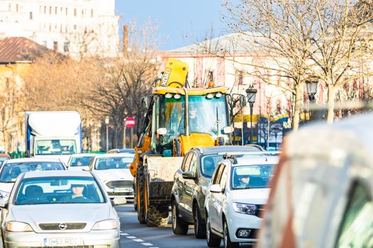 Car traffic at rush hour in downtown area of the city. Car pollution, traffic jam in the morning and evening in the capital city of Bucharest, Romania, 2020