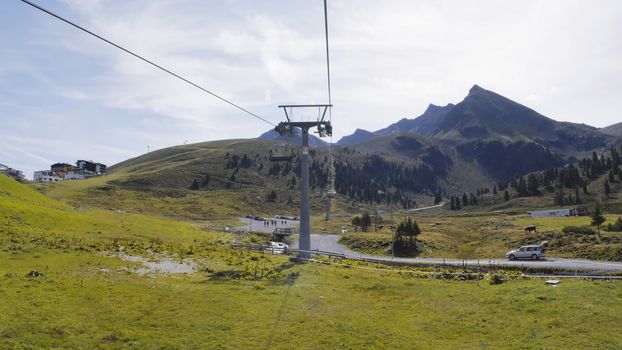 Riding up with a chair lift during summer season in Kuhtai, Austria.