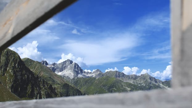 The high mountains of the Austrian Alps in Kuhtai during summer season. The sunshine illuminates the beautiful landscape.