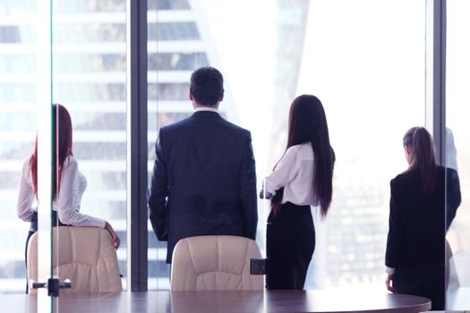 Rear view of business people looking at window