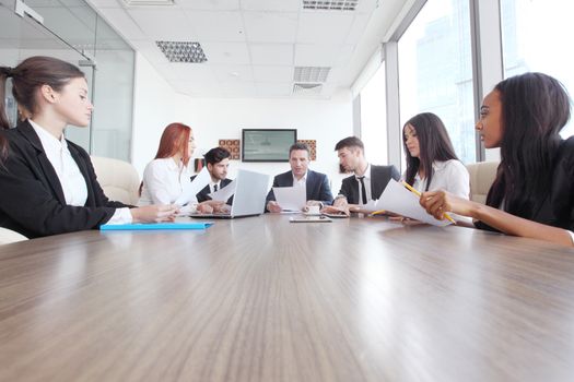 Business meeting of diverse people around the table