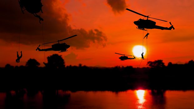 soldier silhouette climb down from helicopter on sunset Concept stop warfare with copy space add text