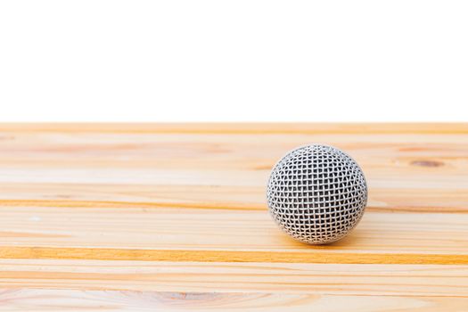 microphone dynamic on wooden table yellow with white background