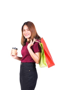 woman pretty smiling holding paper bags and Coffee carton cup in shopping. on white background and look at camera