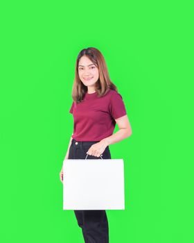 woman holding paper box white. closeup on green background