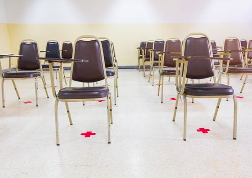 old lecture chairs empty in classroom with social distancing in prevent COVID-19. back to school