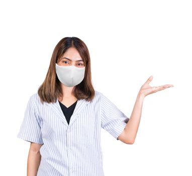 woman wearing fabric mask showing open hand for product or something on white background