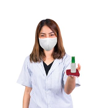 woman wearing fabric mask and product gel antibacterial antiseptic place on hand