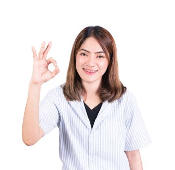 woman showing OK hand sign on white background
