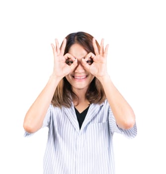 woman showing OK hand sign over eye on white background