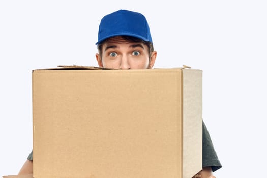 Working man with boxes in hands delivery service work lifestyle. High quality photo