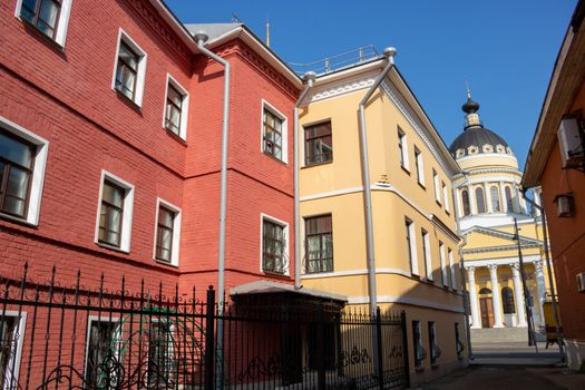 Exterior facade of the red house. Urban vintage background.Bright facades.