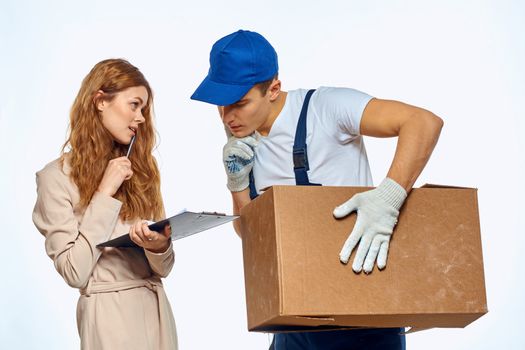 worker man next to woman customer delivery work service. High quality photo