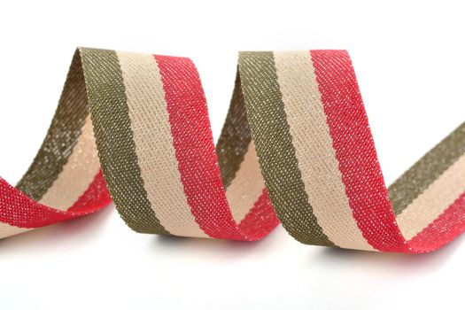 Red khaki green beige Cotton ribbon, strapping tape with curl on white backgroud. Use for sewing clothes, bags. Space for text.