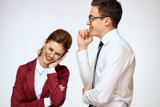 man and woman work colleagues officials communication light background. High quality photo