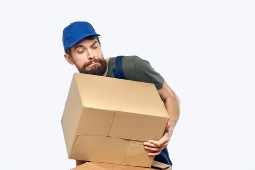 Working man with boxes in hands delivery service work lifestyle. High quality photo