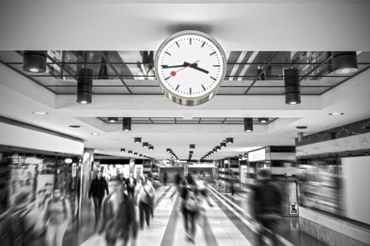 Time to hurry clock in station subway runs for passengers