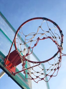 Basketball street court on blue sky background