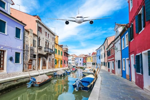 Front of real plane aircraft, on Burano Colorful house in Venice, Italy background