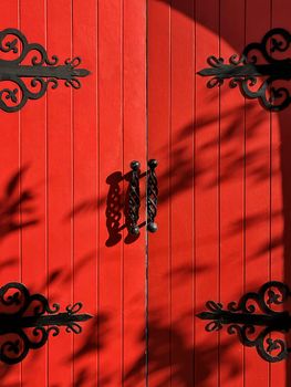 Vintage rustic exterior red door close up and detail