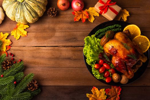 Thanksgiving roast turkey or chicken and vegetables, Top view Christmas dinner feast food decoration traditional homemade on wooden table background, Happy thanksgiving day of holiday concept