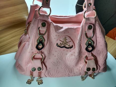 pink colored stylish woman's side bag for sell