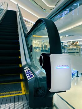 handrail ultraviolet sterilizer for hygiene of escalator handrail at shopping mall as pandemic influenza precautions procedure during Covid-19 situation