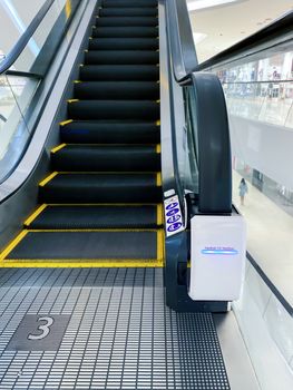 handrail ultraviolet sterilizer for hygiene of escalator handrail at shopping mall as pandemic influenza precautions procedure during Covid-19 situation