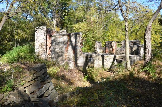 dilapidated brick and stone structure ruins and trees