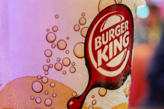 Abu Dhabi, United Arab Emirates, April 2013: Illustrative Editorial: Burger King logo on a soft-drink cup, selective focus