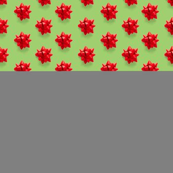 Seamless regular creative Christmas pattern with New Year decorations on green background. xmas Modern Seamless pattern made from christmas decorations. Photo quality pattern for fabric, prints, wallpapers, banners or creative design works.