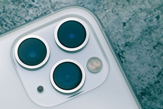 Close up shot for scratch on iPhone11 Pro Max rear camera lens, the triple camera system of ultra wide, wide and telephoto lenses. lenses should have been protected
