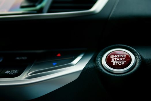 engine start/stop button in modern car, shallow depth of field