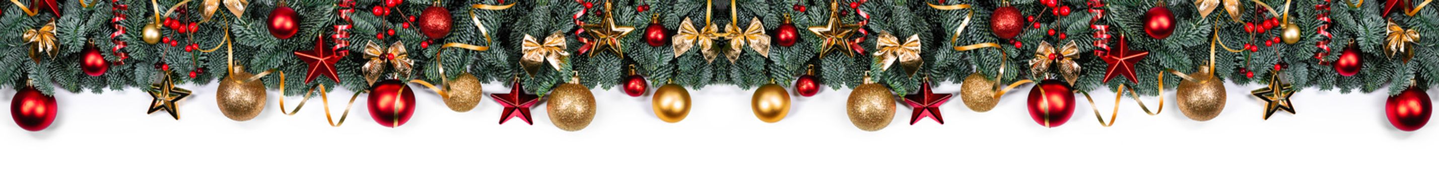 Christmas border frame design copmosition of noble fir tree branch and red golden decorations baubles isolated on white background