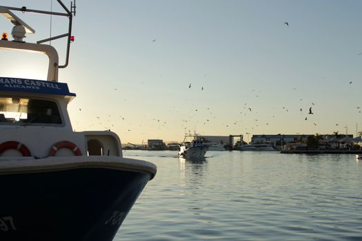 Fishing boat entering port in southern Spain, Santa Pola, Alicante