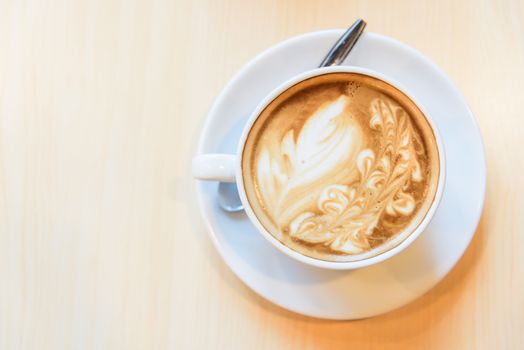 hot coffee on table / hot cappuccino with nice pattern milk foam