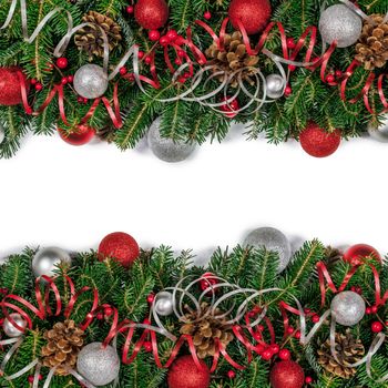 Christmas border frame design copmosition of fir tree branch and red silver decorations balls baubles ribbon pine cones isolated on white background