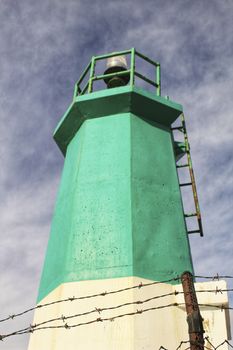 Colorful lighthouse in the dock in southern Spain